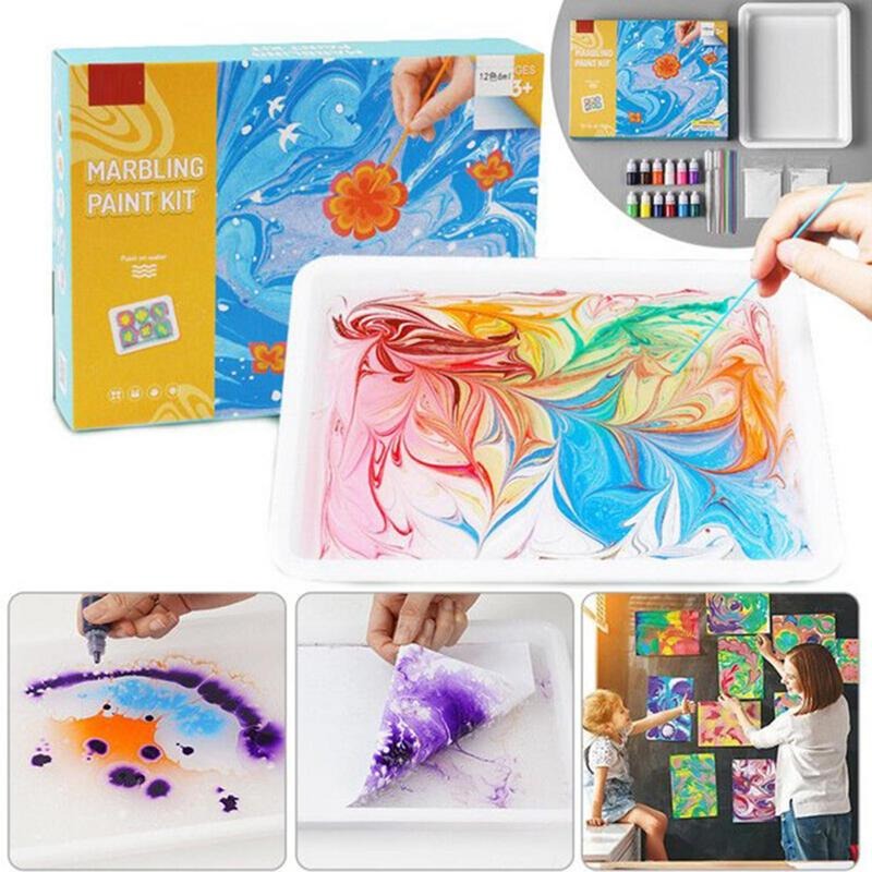 Marbling paint kit with colorful designs, a tray, paint bottles, and examples of finished artwork