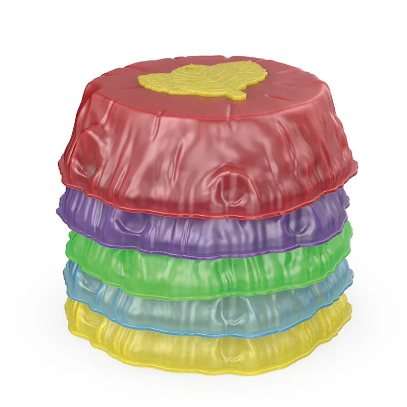 Red, purple, green, blue, and yellow balance stones stacked together