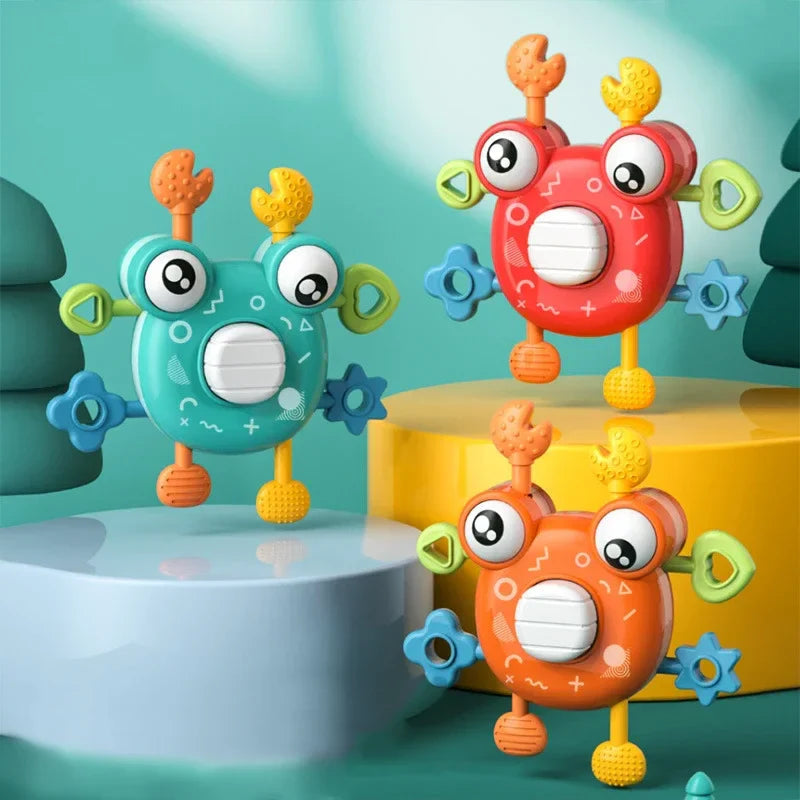 Green, red, and orange crab sensory toys with textured claws and colorful side pieces
