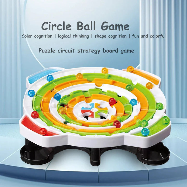 Rotating ball maze with green and yellow rings, colored balls, and a white base.