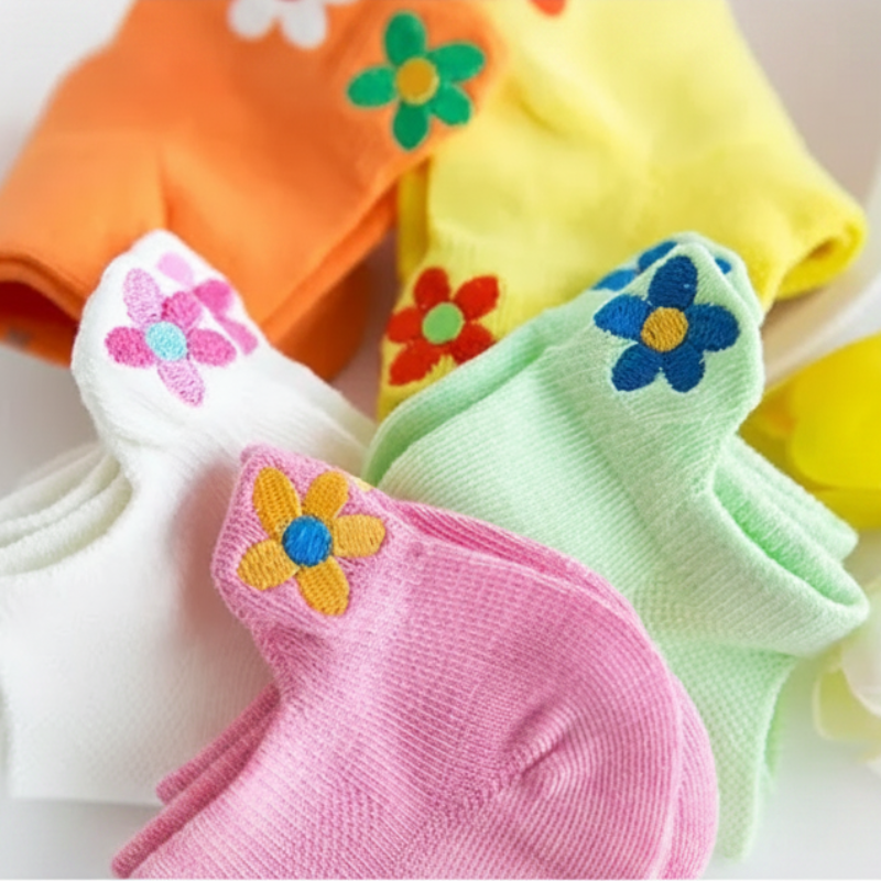Low-cut socks in pink, white, green, orange, and yellow with flower motifs