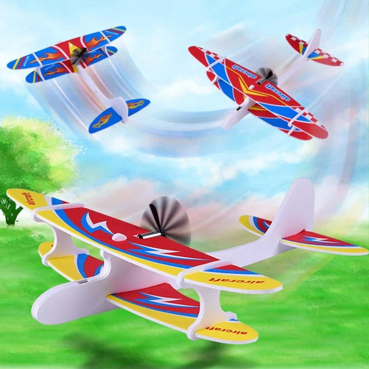 Foam propeller airplanes illustrated in flight above a grassy outdoor scene