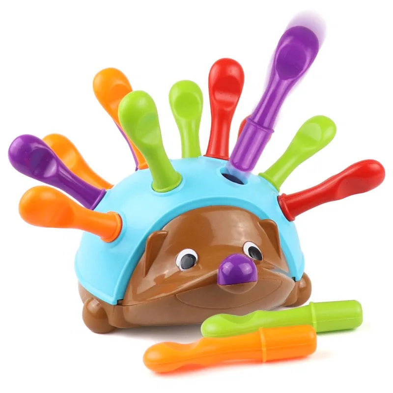 Blue and brown hedgehog toy with colorful removable quills and two loose pieces