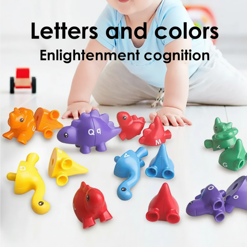 Colorful letter dinosaurs and separated matching halves arranged on a white surface