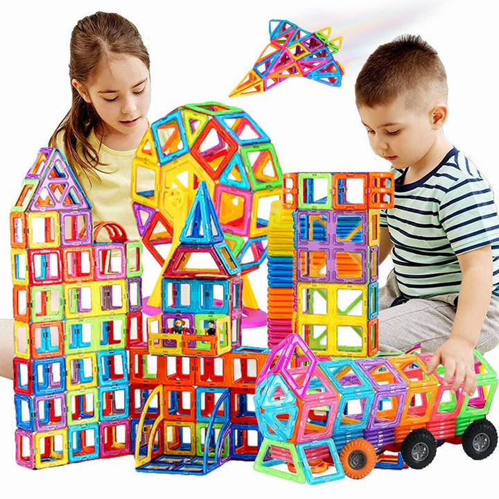 Two children building colorful magnetic towers and wheeled models