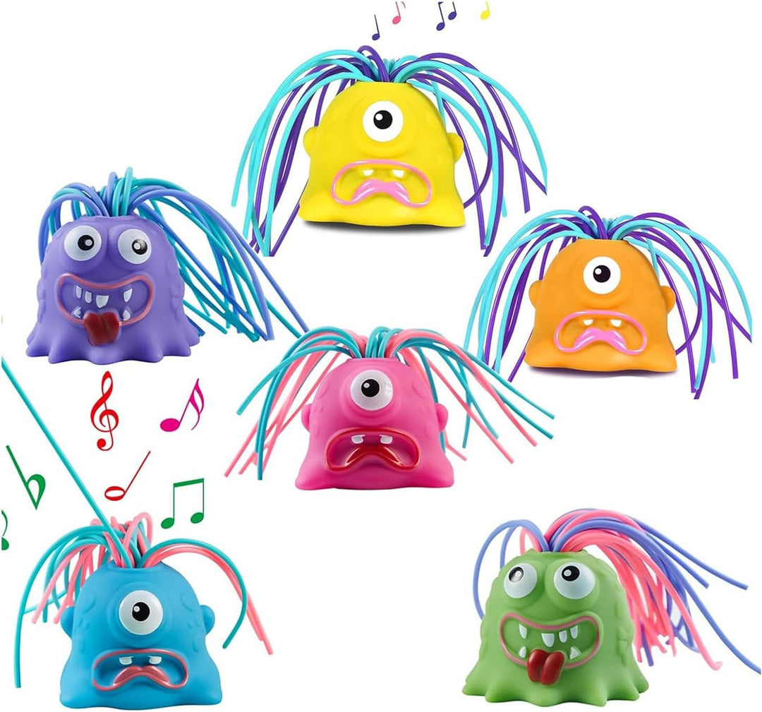 Six monster stress toy colors arranged with musical note graphics