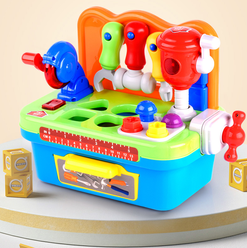 Colorful toy workbench with hanging pretend tools, sorting openings, and a blue storage base