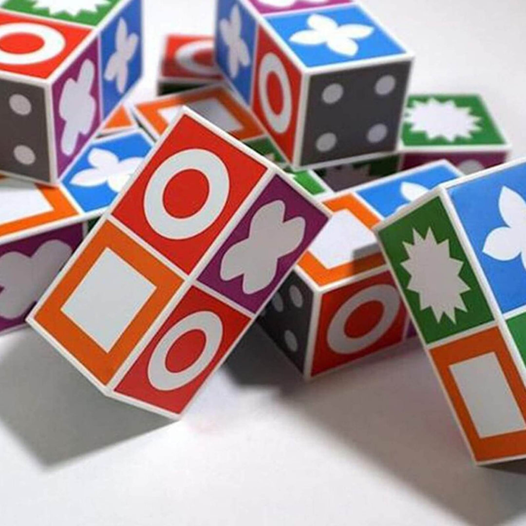 Colorful rectangular puzzle pieces showing circles, squares, dots, and other shapes