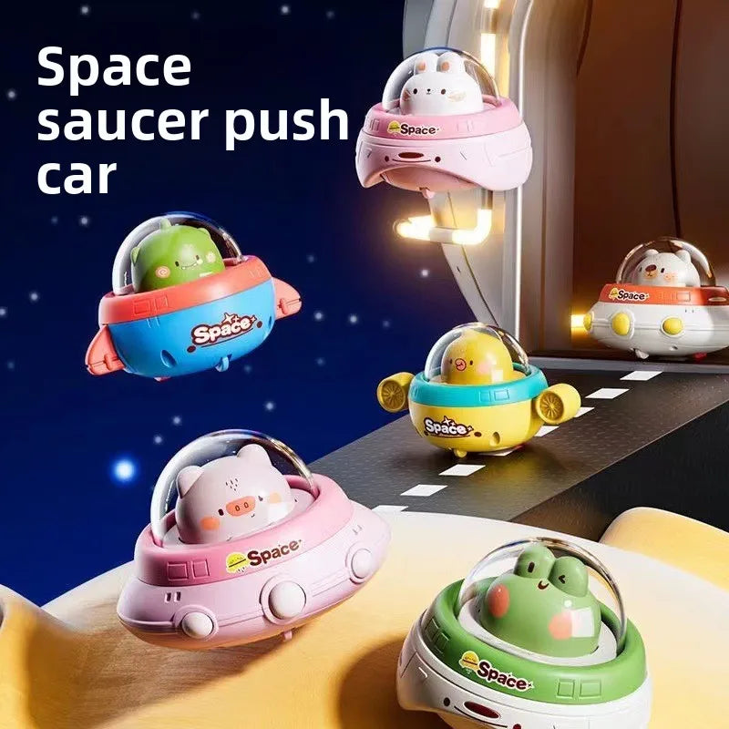 UFO toys with animal pilots and clear domes in a space-themed display.