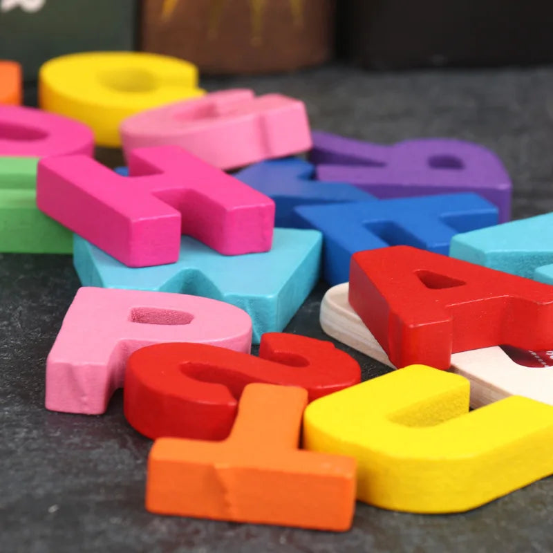 Close-up of colorful wooden letter pieces showing their raised thickness