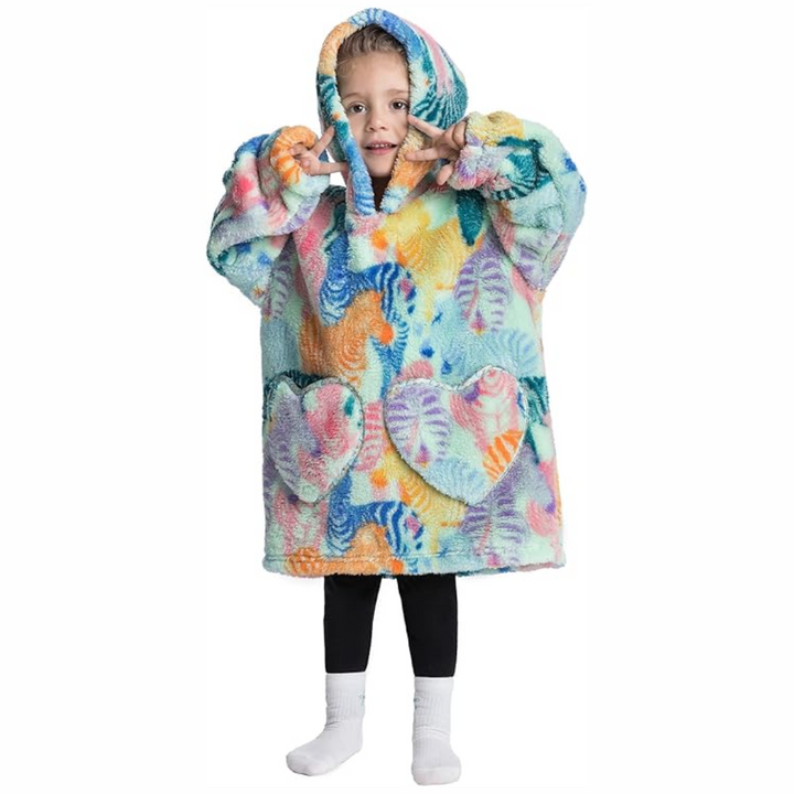 Child wearing a colorful zebra-print hooded blanket with two front pockets