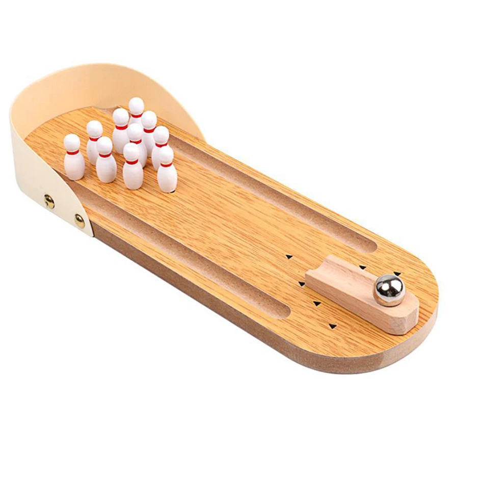Angled view of the wooden bowling lane with raised sides, mini pins, and a ball on the ramp