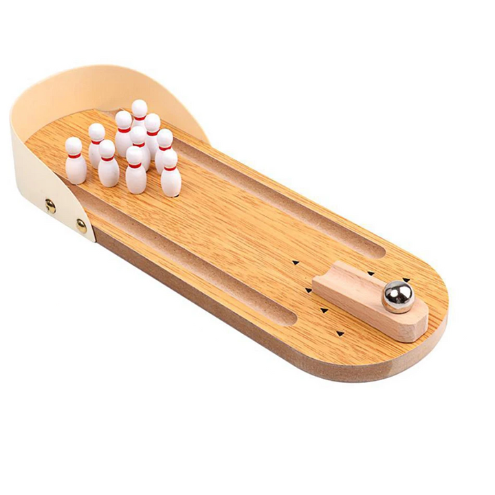 Angled view of the wooden bowling lane with raised sides, mini pins, and a ball on the ramp