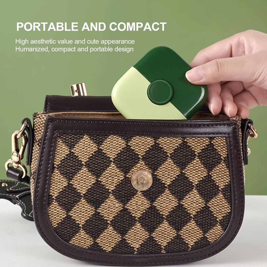 Green compact hair trimmer being placed into a small handbag