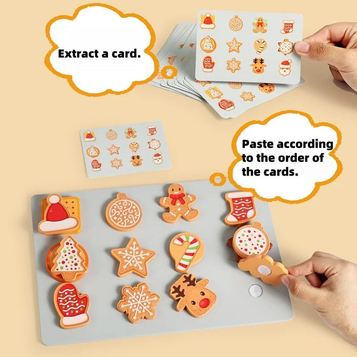 Hands matching festive wooden cookie shapes to a pattern card on a gray tray.