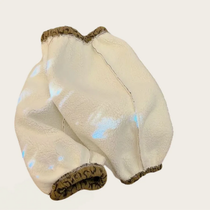 Brown heart pants turned inside out to show the cream fleece lining