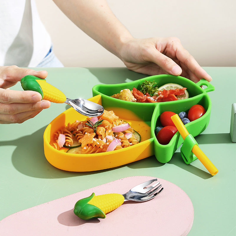 Corn-shaped divided plate with pasta and vegetables, shown with corn-handled cutlery