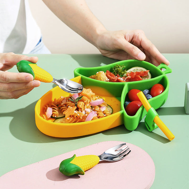 Corn-shaped divided plate with pasta and vegetables, shown with corn-handled cutlery