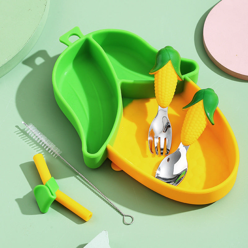 Green-and-yellow corn plate with matching cutlery, a straw, and a straw-cleaning brush