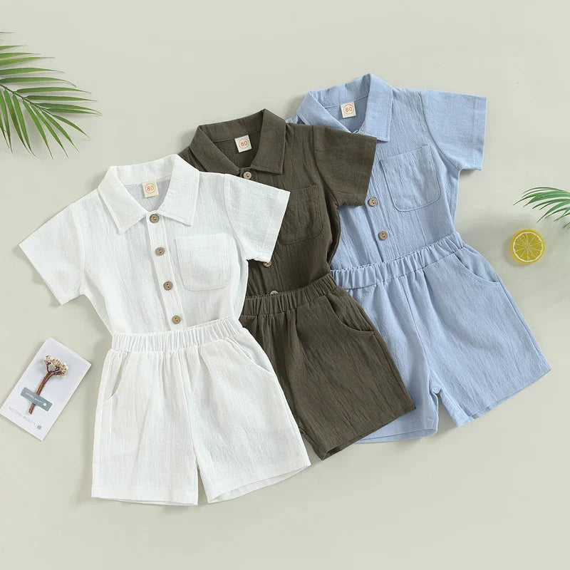 White, green, and blue cotton baby outfits with short-sleeve collared shirts and matching shorts