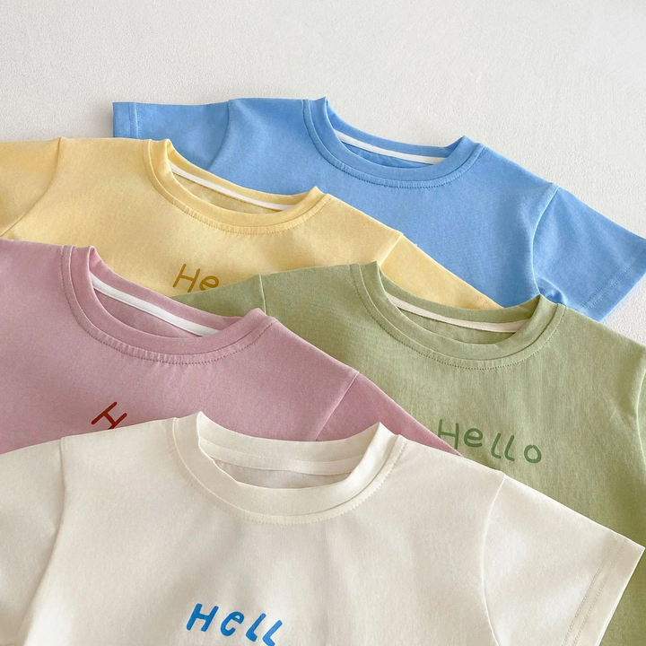Close-up of crew necklines on beige, pink, green, yellow, and blue children&