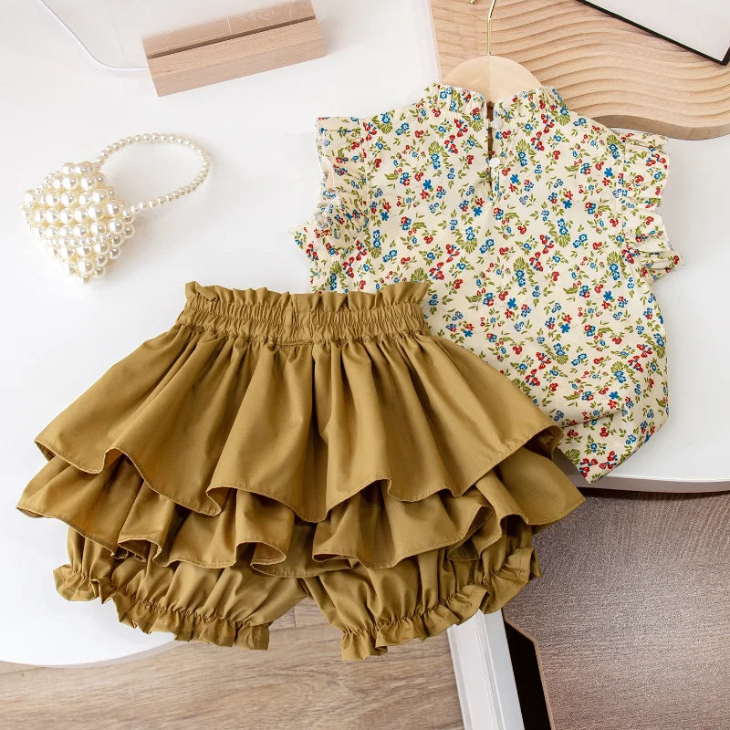 Two-piece cotton outfit with the floral top beside the gathered-waist ruffled skirt