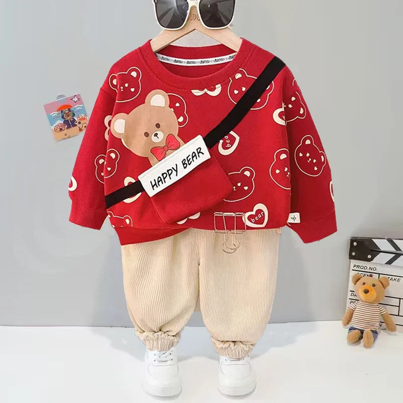 Red bear-print sweater and beige gathered-cuff pants displayed as a coordinated outfit