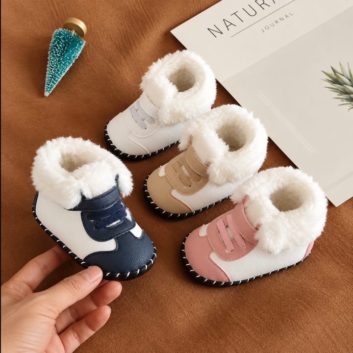 Baby winter boots in blue, white, gold, and pink with fluffy white cuffs