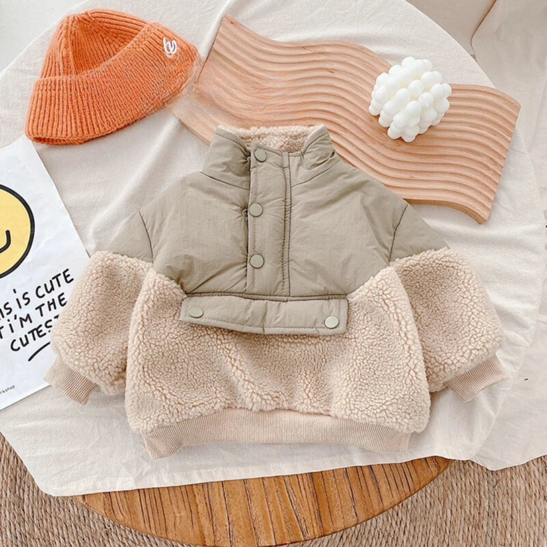 Front of khaki and beige fleece jacket with a stand collar, snap placket, and ribbed hem