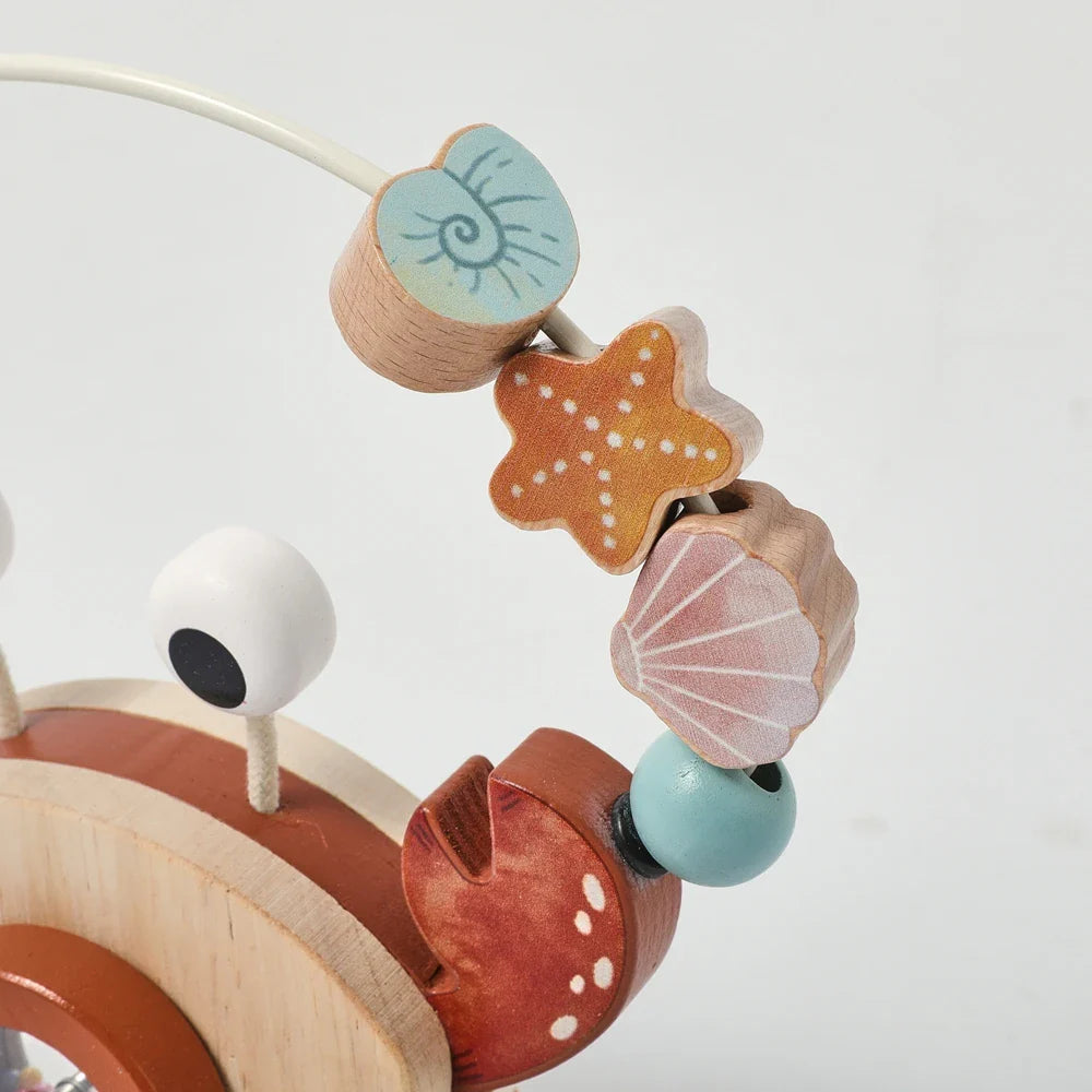 Shell, starfish, and round beads on the crab toy&