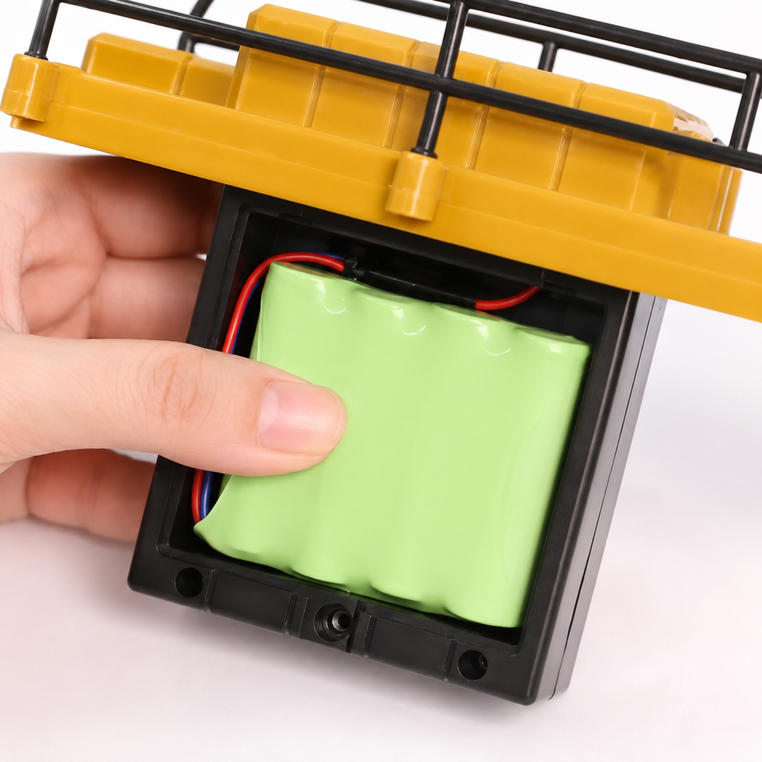 Open crane battery compartment holding a green rechargeable battery pack.