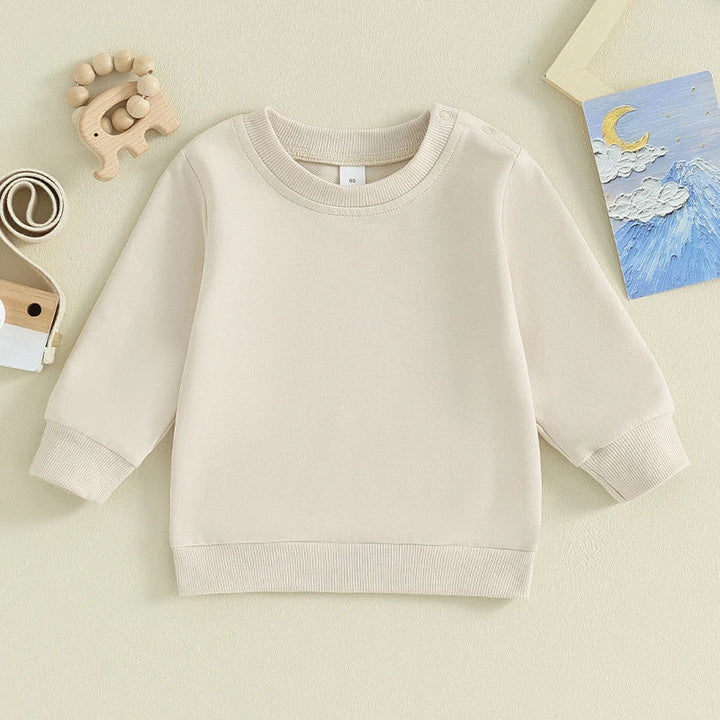Cream baby sweatshirt with long sleeves and ribbed neckline, cuffs, and hem