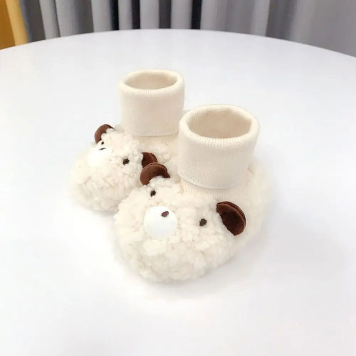 Cream bear baby slippers with textured uppers and tall ribbed ankle cuffs