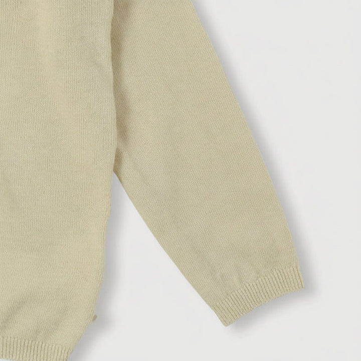 Cream knit cardigan sleeve and hem with ribbed edges