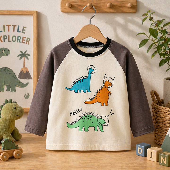 Cream raglan sweatshirt with dark sleeves and three colorful cartoon dinosaurs