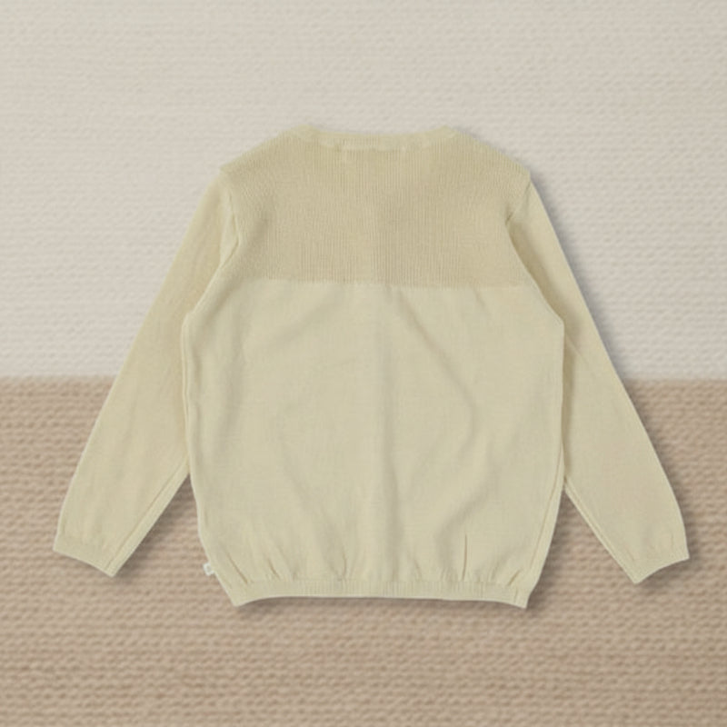 Back view of a cream long-sleeve knit cardigan with a textured upper panel