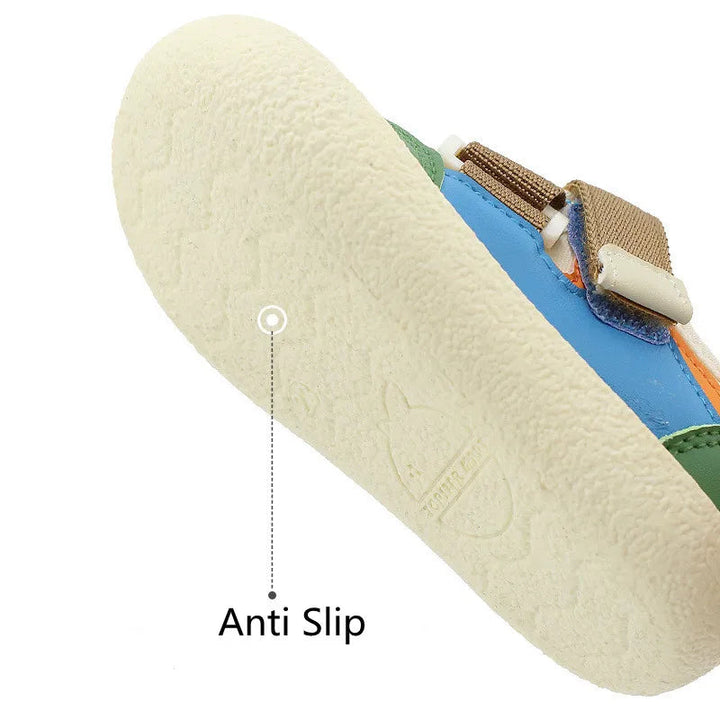 Textured cream outsole on a green and blue kids&