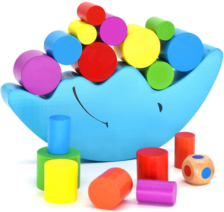 Blue crescent balancing base stacked with colorful wooden cylinders, with loose blocks and a color-dot die