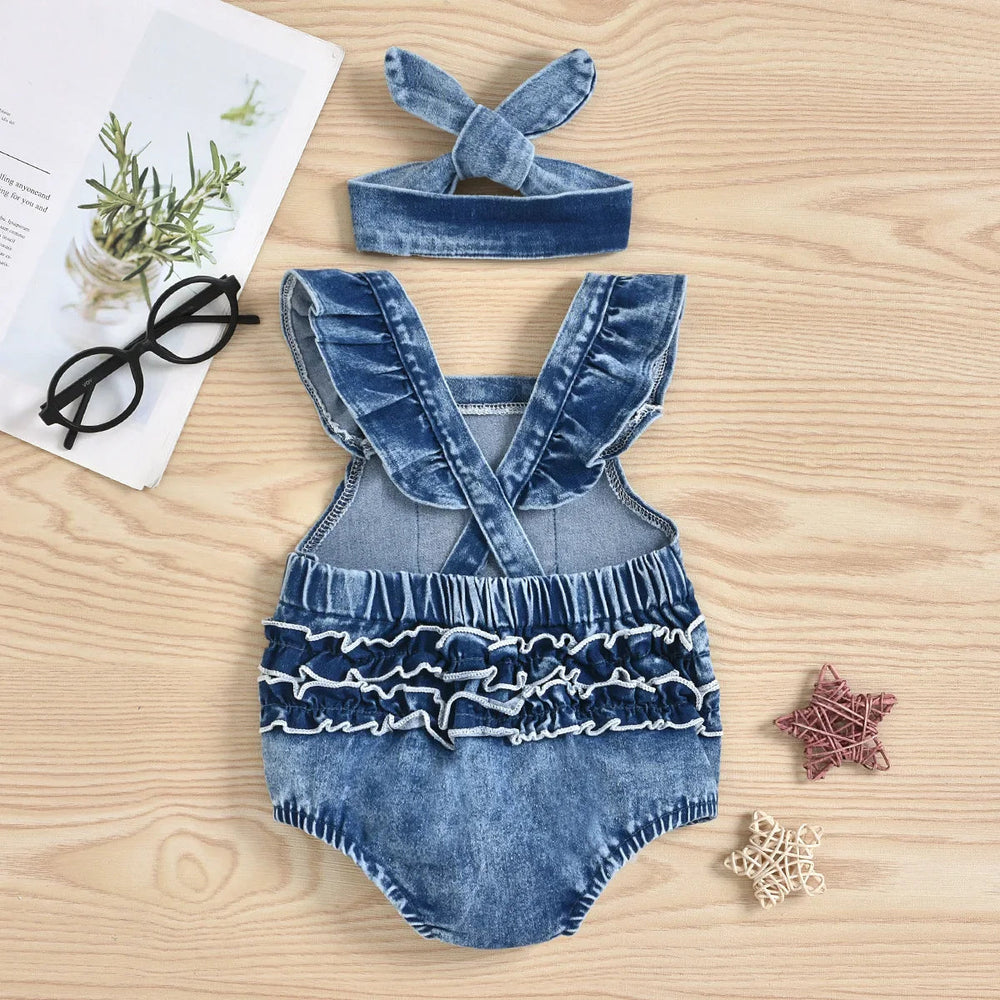 Back of denim romper with crossed straps, layered ruffles and matching bow headband