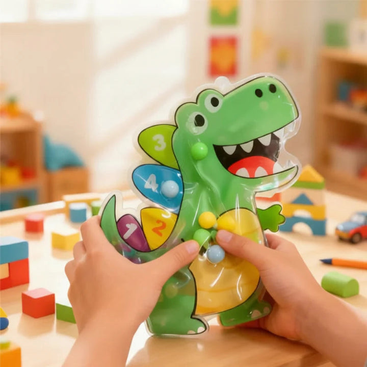 Hands moving colorful beads inside a green crocodile-shaped sensory maze
