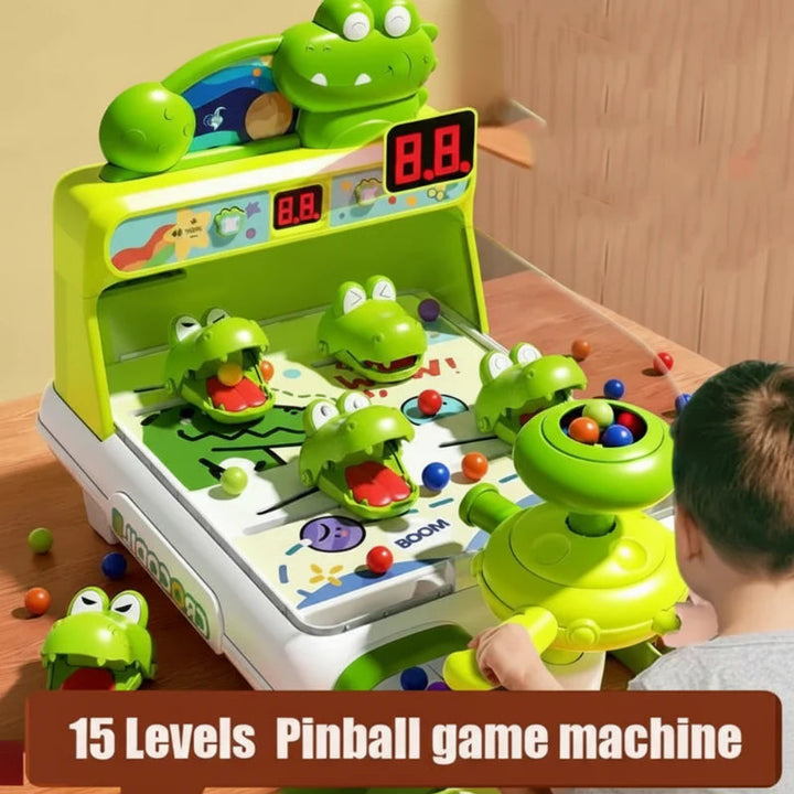 Child playing a green crocodile arcade game with an illuminated digital scoreboard