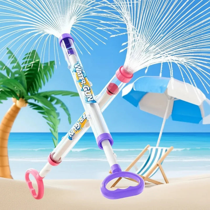 Pink and purple water guns crossed in a beach scene with wide sprays of water.