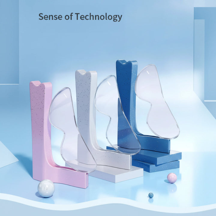 Clear curved lens pieces on pink, white and blue display stands