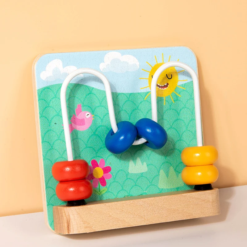 Wooden bead maze busy board with curved wire tracks and red, blue, and yellow beads.