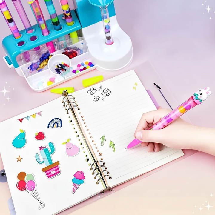 Hand drawing in a notebook with a pink beaded pen beside the craft station