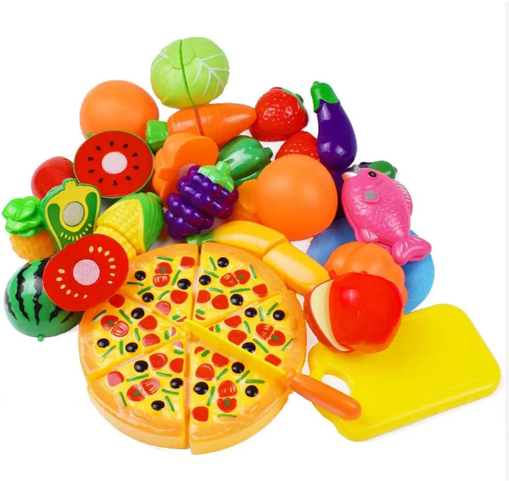 Assorted play fruits and vegetables with a sliced toy pizza, yellow cutting board, and toy knife