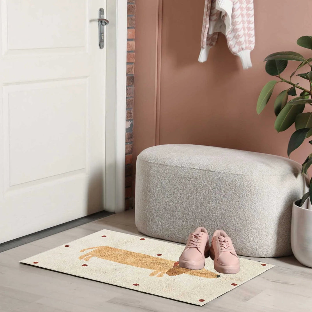 Dachshund rug near a doorway with pink shoes and a gray ottoman