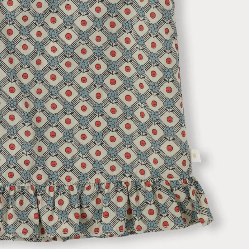 Close-up of the daisy-print blouse fabric and ruffled hem