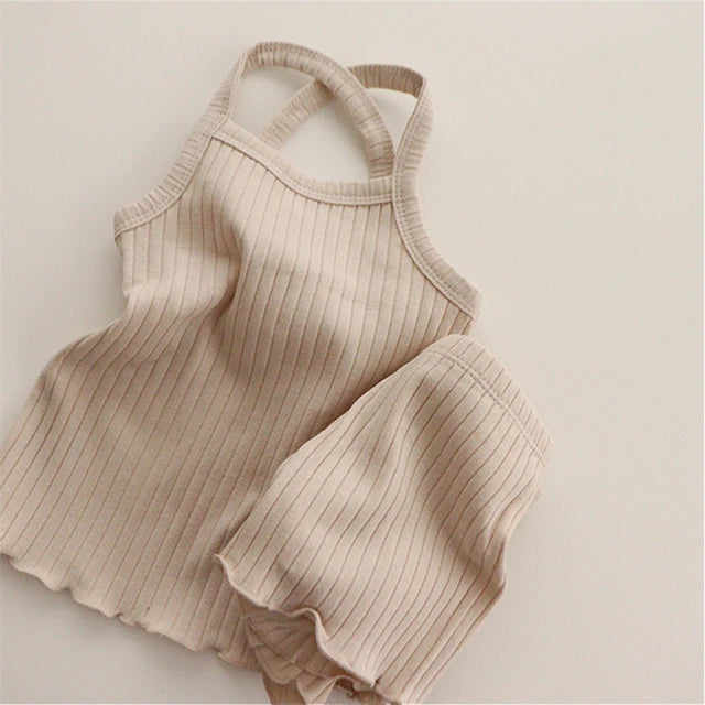Dark beige ribbed pajama tank and shorts with crossed straps and rippled hems