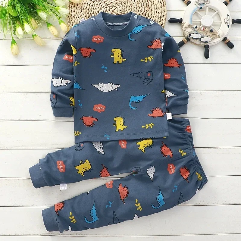 Dark blue pajama set with multicolored dinosaur prints and matching long pants